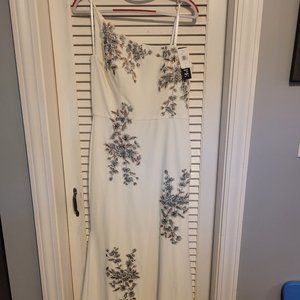 Gorgeous white dress off one shoulder with black and silver sequences